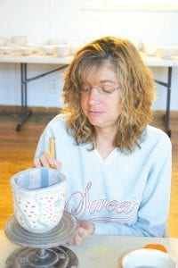 Nicki Boostrom was one of a dozen volunteers who showed up last Saturday at the Grand Marais Art Colony and carefully painted bowls. The colorful pottery will be used at the Empty Bowls dinner and Silent Auction on Thursday, Nov. 11. The event will be held at the First Congregational Church from 11 a.m. to 2 p.m. and from 5 p.m. to 7 p.m. All proceeds go to the Cook County Food Shelf.