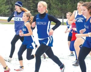 Viking cross country runners are accustomed to running in cold weather, but the Section 7A meet was postponed because of a 10-inch snowfall at the Cloquet Country Club. However, on Friday, October 29, Viking runners were ready and all finished with personal best times. Matea Acero, Sara Schield, and Audrey Summers hang together in the pack at the Section 7A race.