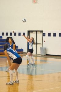 It has been a great season for the young Viking volleyball team. They earned a season best record—20-4­— and earned a second place finish in Section 7A. The Vikings were a powerhouse on home court this season. Here, Bekah Laky serves as Ashley Deschampe (No. 5) and Theresa Morrin (No. 3) get ready for the return.