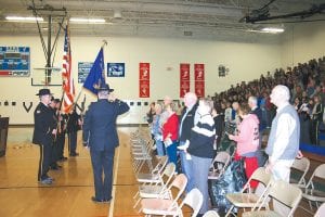 A large crowd gathered at Cook County High School November 11, 2010 to honor America’s veterans. Top: The American Legion Post #413 Honor Guard punctuated the band concert with a flag ceremony. Above left: Senior Sarah Warren sang the Star Spangled Banner. Above right: Honor Guard (L-R): Commander Don Wilson, Jim Anderson, Bob Mattson, Orvis Lunke, and Jim Ford.