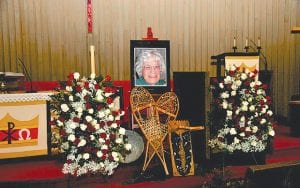 The community gathered twice to say goodbye Lake Saganaga matriarch Dinna Madsen—once on her beloved lake and once at Bethlehem Lutheran Church in the town of Grand Marais. At the memorial were Dinna’s snowshoes and the tikinagan she used to carry her children.