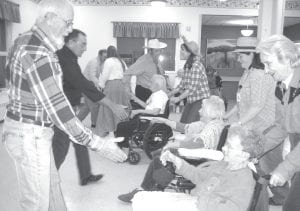 The North Shore Care Center was the place to do-si-do on Saturday, November 27 when for the third year the Arrowtippers Square Dancers performed for residents and families. Residents and Care Center activity staff joined the Arrowtippers for The Virginia Reel. They had so much fun they did it twice!