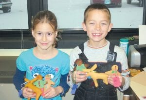 In addition to the great deals community members have grown used to from Cook County KIDS PLUS with the KIDS PLUS saver cards, this year the holidays can be brightened by homemade ornaments made by the kids who enjoy KIDS PLUS activities, like Dominic Wilson and Lucy Shaw.