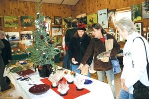 Shoppers enjoyed some early holiday shopping at the Hovland Arts Festival on Saturday, November 27. Artwork filled tables and lined the walls of the Hovland Town Hall.