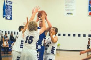 Above: Colin Everson went up for two against three Albrook Falcon defenders. Everson had a great all around game, scoring 14 points on a variety of nifty drives to the bucket. He also played tough defense and was integral to the Vikings' win last Tuesday night.