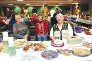 The Grand Portage Elders had tasty treats and a variety of crafts for sale to fund activities for the Elderly Nutrition Program though the year. (L-R) Donna Anderson, Ellen Olson, and Carol Hackett enjoyed visiting with shoppers.