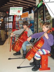 Beautiful holiday music filled the air at Johnson’s Foods last week as Will and Louise Ramberg (fourth and second grade students at ISD 166) played cello solos, duets, and even trios with Sawtooth Elementary teacher Lorelei Livingston on trombone.