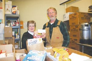 The Grand Marais Post 413 Sons of the American Legion have answered the call to assist the Cook County Food Shelf. On November 22, the Sons donated a check for $350, but after hearing that there was still a great need, they decided to give more. On Tuesday, December 14, David Johnson, representing the Sons of the American Legion, dropped off another donation of $400 to the Cook County Food Shelf. Accepting the donation is Food Shelf Volunteer Gwen Lenz. In addition to financial and food donations, the food shelf is also in need of a small refrigerator. If you would like to help the local food shelf meet its needs, contact food shelf volunteer Bill Lenz at (218) 387-9860.