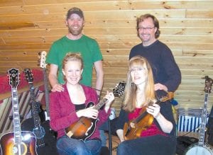 Cook County’s newest band, Blueberry Jaam, will be helping ring in the New Year with a free fireside performance (including goodies and hot drinks) at the 4-H log building in Grand Marais at 7:00 p.m., Saturday, January 1, 2011. (L) Andy and Amy Schmidt and (R) Jim and Michele Miller.