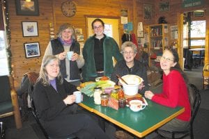 Members of the Northwoods Food Project gathered at Java Moose in Grand Marais recently to show off samples of foods that could be featured in the upcoming A Backward Cookbook Celebrating Local Foods. With their delectable soups, breads, canned, and baked goods are (L-R) Kristine Bottorff, Joan Farnam, Jan Attridge, Kaitlin Erpestad, and Melinda Spinler.