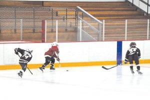 Cook County M2s had a great weekend of hockey at the Two Harbors tournament December 11 – 12. Above: Trevor Berglund on a break away.