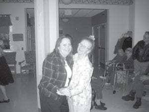 Above left: Sharon Berglund and Marigold Linnell enjoyed dancing to a Perry Como song on New Year’s Eve at the Care Center. Above: Live on WTIP! Remember When features original ‘40s and ‘50s music and for the New Year’s show, Care Center residents helped select the songs. Residents also provided commentary. Here Janet Morgan helps hosts Jane Ranum and Bruce MacDonald. Left: Sister and brother, Donna Joynes-Willett and Howard Joynes were all smiles as they sang Auld Lang Syne.