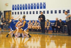 Left: Brea Boomer pulls the ball out of the hands of a Moose Lake/Willow River player while Ailee Larson (3) traps the ball handler on the other side. This withering defensive pressure is what the Rebels faced all night long, and it led to a lot of fast break baskets for the Vikings, who won overwhelmingly. Above: Ashley Deschampe lines up to shoot a 3-point shot, which she made. Deschampe nailed four 3-point shots last Tuesday night. Deschampe scored 22 points on a night that saw the starters go to the bench early to allow the subs to come in and get some varsity playing time.