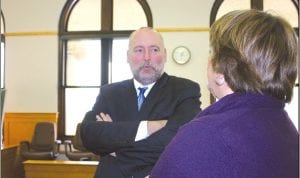 Judge Mike Cuzzo visits with a citizen at the informal afternoon gathering at the Cook County courthouse on January 3. Cuzzo took the oath of office at the Lake County courthouse earlier that morning.