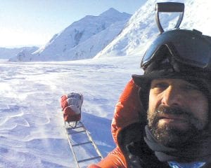 Lonnie Dupre is shown pulling his 150-pound sled across the wintry ice scape of Mount Denali. Dupre is trying to become the first person to solo climb Denali in the month of January.