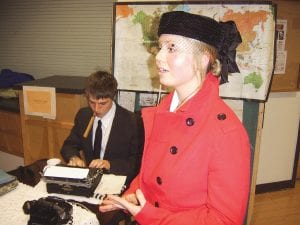 Intrepid reporter Nellie Bly (Molly Rider), with her colleague (Chris Rider) working behind her, talks about the challenges of her life as one of first female investigative journalists at the Night of the Notorious on Monday, January 10. The event at the Arrowhead Center for the Arts included 20 notable and notorious characters depicted by Cook County High School students. Read more about the interesting event on page A3.