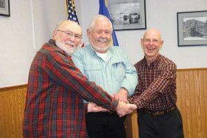 Grand Marais City Council’s first meeting of 2011 began with newly elected members taking the oath of office. Shown sharing a handshake following the ceremony are, from left, Councilor Bill Lenz, who was reelected in the November 2010 election; new mayor Larry “Bear” Carlson; and new councilor Bob Spry. City Council meets at 4:30 p.m. the second and last Wednesday of every month at City Hall.