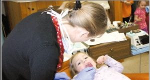 Dr. Alyssa Hedstrom checks the teeth of a pre-schooler during a school trip to the dentist office. Grand Marais Family Dentistry is taking part in “Give Kids a Smile”, which will be held on Saturday, Feb. 5 and is free to kids. This is the first time the local dentist office is taking part in this program, which is backed by the Minnesota Dental Association.