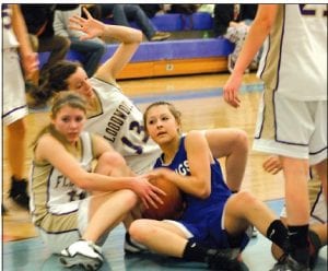 Theresa Morrin fights a Floodwood player for the ball in the Vikings' game against their toughest rival to date. The Vikings lost a hard fought contest to Floodwood but, according to the Polar Bears' coach, he expects the two teams to see each other later in the play-offs.