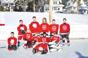 The Cook County Mite 2s put up a great fight at the Portman Jamboree on January 15 -1 6. Front: Goalie Trevor Berglund. (L-R, front) Nathan Bilben, Ella Sporn, Lucas Sheils, John Vander Heiden, Tucker Foley. (L-R, back) Ryan Bilben, Jayden Grivette, Alyssa Lashinski, Noah Furcht, and Chase Gwash.