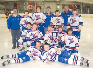 After a hard-fought championship game against Forest Lake, which had a much deeper bench, the Silver Bay-Cook County Peewees happily posed with their first place trophy. (L-R, front) Nate Mealey and Frankie Miller. (L-R, kneeling) Nick Perfetto, Caleb Dilley, Corey Napper, Jack Wieben, Tanner Ketola. (L-R, standing) Coach Mike Ketola, Chase Jasperson, Nathan Bauck, Coach Dave Dilley, Justin Ketola, Coach Mark LeBlanc and Carter LeBlanc.