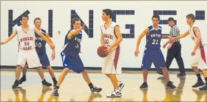 Ryan Martinson (3) steps out to stop the Mesabi East center while Dylan Quaife (10) and David Bergstrom stay close to their men in the game played last Tuesday night at home. Despite playing great defense, the Vikes couldn’t hit enough of their shots and fell just short of victory in a nip and tuck contest against the Giants.