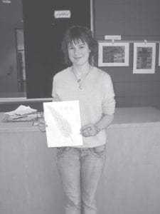 Jordyn Kirk of Grand Marais, with her winning design for a new logo for the Violence Prevention Center.