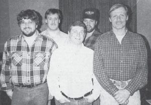 The Grand Marais Volunteer Fire Department rang out the old and rang in the new while welcoming new firemen in this Feb. 11, 1991 Cook County News-Herald photo. Shown, from left, are Bruce Johnson, Mark Falk, Dan Ansello, Tim Suck and Bruce 