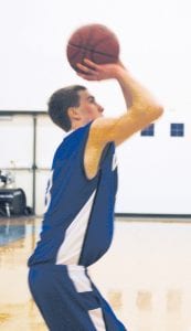 Senior guard Ryan Martinson sports a good mid-range jump shot. Here he lines up and puts one in against Two Harbors. Ryan is averaging a little more than 12 points per game for the season.