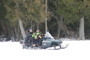 Easter Seals Ambassador Zachary Pylychuk, 7, got his first snowmobile ride at the 2011 Snowarama for Easter Seals at the Grand Portage Lodge & Casino on Saturday, February 5. Zachary is safely tucked between his mom, Jacqueline, and the driver, Tony Swader of the Grand Portage Trail Riders snowmobile club. Yeah, Zach!