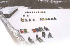 The eighth annual Snowarama for Easter Seals Kids was held at the Grand Portage Lodge & Casino and on the fabulous trails maintained by the Grand Portage Trail Riders Snowmobile Club on Saturday, February 5. The event raised $29,000 for Easter Seals. There were 95 snowmobiles on the trail during Snowarama. Some of the machines and riders are pictured here preparing for the day on the Trail Riders trails.