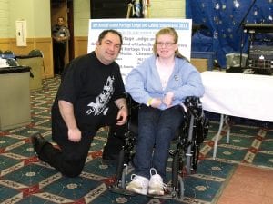 Frank Vecchio of Grand Portage Marketing chats with Easter Seals Ambassador Erica Valiharju at the Snowarama spaghetti dinner on Saturday evening.