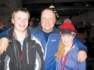 Above: A very happy Cook County Nordic Ski Coach, Mark Summers, congratulates Section 7 Championship finishers, Kieran Scannell and Shelby Ahrendt. The varsity cross-country skiers advance to the State Meet.