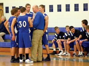 a found Coach well in hand, Head Mitch Dorr time for against Floodwood With the game players. (L- R) Colin Everson, Kale Boomer, David Bergstrom, Ryan Martinson little levity with his and Dylan Quaife.