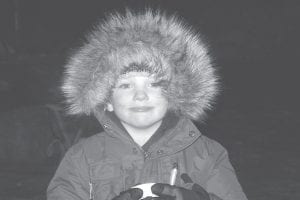 The Birch Grove Community School held its Annual Winter Extravaganza on Thursday, February 10. Students and families enjoyed a delicious spaghetti dinner, a bonfire, an outdoor movie, and ice-skating. Cy Oberholtzer warms up by the bonfire with a cup of hot chocolate.