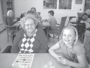 Bingo seems to be everyone’s favorite. The students especially like to use the microphone and call bingo, help residents and win prizes. Sophie Eliasen and Peg Keller work together to win a prize.