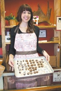 Chelsea Lueck, new owner of Gunflint Mercantile, looks right at home in the cozy little dry goods and candy company.