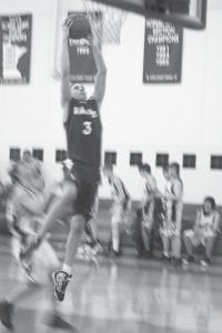 Left: Ryan Martinson is one of the few boys in Cook County the last few years who can dunk a basketball. The 6’4” guard has some hops and gets the crowd going when he elevates and slams the ball down. Above: Will Petty is getting more and more playing time, and his minutes off the bench are crucial to the success of this team. Will is a great team player, a tough defender who plays within himself and takes good care of the ball.