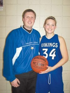 Head coach T.J. Super awarded Brea Boomer with a game ball commemorating her scoring over 1,000 points during her years as a player on the varsity. Brea went over the 1,000 point mark in a game against Wrenshall played March 3.