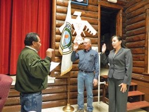 The Grand Portage Band of Lake Superior Chippewa welcomed its new tribal council members on Wednesday, March 2, 2011. Giving the oath of office is Tribal Council Chairman Norman Deschampe. The new council members are Arvid Dahl, committeeman and April McCormick, secretary-treasurer.