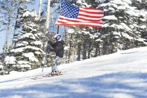 Skiing in the USA! Claire LaVigne swooshes down the slope carrying the red, white, and blue!