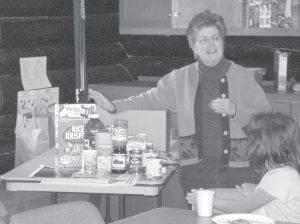 Gwen Lenz paid a visit to the After School Lounge recently to share information about the Cook County Food Shelf, and she brought along a box of food that is typically given to a family of four Students learned that approximately 120 households use the Grand Marais food shelf each month