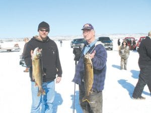 Although there weren’t a lot of fish caught on Gunflint Lake at the Cook County Ridge Riders Trout Derby on Sunday, March 13, the ones caught and entered in the contest were decent sized this year. Those in attendance also enjoyed spending the day under bright blue skies next to a roaring, ice-melting, bonfire. Winning first and second place were Brian Schroeder (left) with a 7.1 pounder and Dan Childs with a 6.7-pound trout. Nice fish guys!