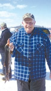 Don Roberts brought in one of the first fish of the day. His trout was 2.4 pounds, not too small, but small enough to win the “boobie prize”—a box of steaks!