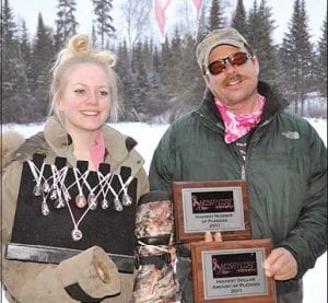 Jessica Berg-Collman was again the top fundraiser, earning awards for the most pledges collected and the most money earned. Helping her with her awards is Dennis LaBoda, whose dogs pulled Jessica in the fun run.