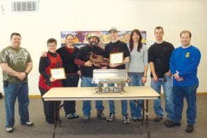 Four teams came out on top at the Second Annual Cook County Chili Cook-Off March 19, 2011 at the community center and 4-H building in Grand Marais. (L-R) Rich Fortunato ( judge); Yvonne Gennrich and Jen Sutton representing Grand Portage Community Church (second place and winner of the people’s choice award); Bruce Block and Trevor Delamater of Team Stealth and The Bruce (first place); Chelsea Lueck, owner of Gunflint Mercantile (tied for third place); and Aaron Logan and Jared Berg of the U.S. Border Patrol (on their own time and with their own funds, also tied for third place).