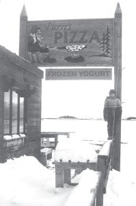 Pierre’s Pizza was a great place to warm up in the winter. This picture of the restaurant on the Grand Marais waterfront was taken by Gary Siesennop just a short time before the building burned down in the 1980s. Standing on the railing is Gary’s son, Michael.