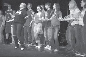 Sarah Warren led the merry cast of Theater Sports students in a final song as the cast wrapped up a fun filled evening on March 17, St. Patrick’s Day. A full house turned out to help raise funds for the students who will use the proceeds to help pay for a trip to the Twin Cities to attend a play.