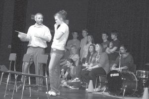 Left: Michael McHugh talks over a skit with a perplexed Brea Boomer.