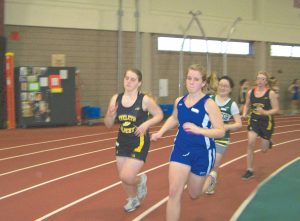 Katrina Axtell leads a group of half milers in the first meet of the season held on the indoor track at University of Wisconsin in Superior. Katrina didn’t win, but ran well.